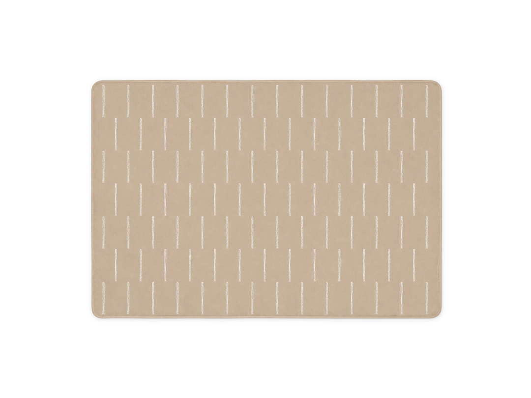 Lollibly Shortbread Plush Playmat in Big One (200 × 140 cm). A rectangular beige mat with rounded corners, featuring a repeating pattern of thin vertical white lines.