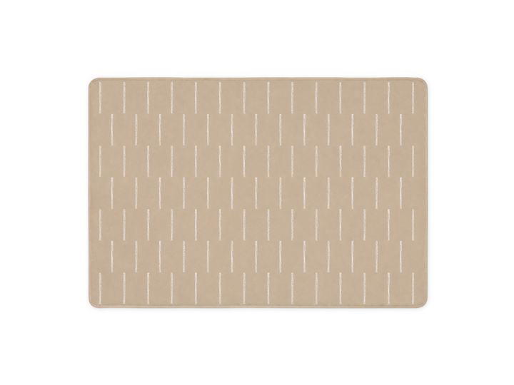 Lollibly Shortbread Plush Playmat in Big One (200 × 140 cm). A rectangular beige mat with rounded corners, featuring a repeating pattern of thin vertical white lines.